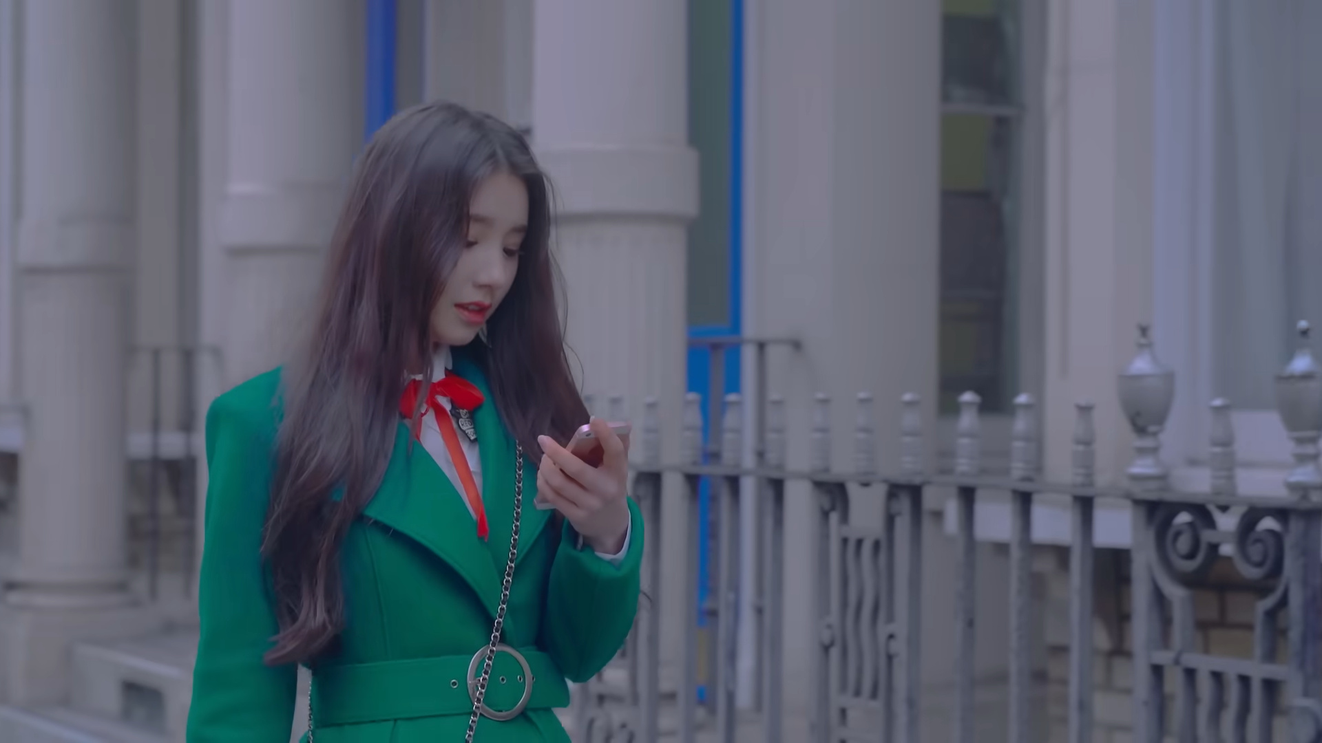 Heejin looking at her phone.